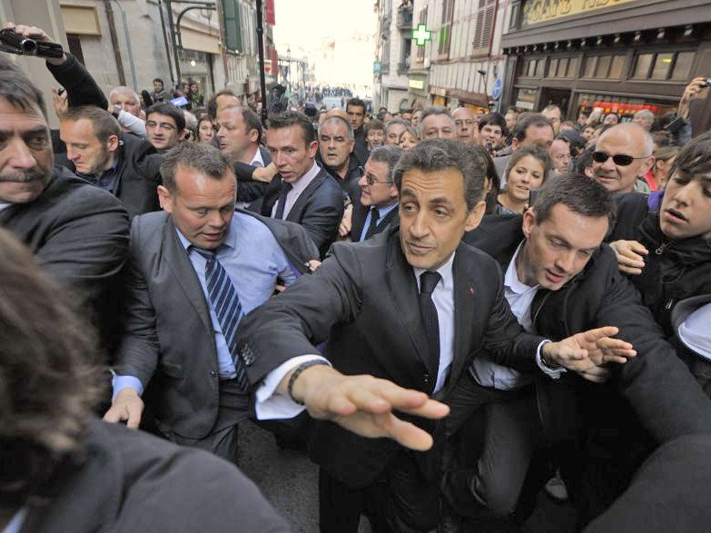 Riot police surrounded the Bar du Palais in Bayonne, where Mr Sarkozy holed up to get away from the protesters