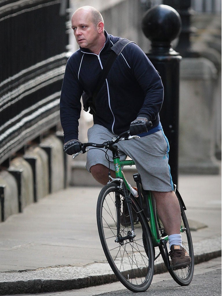 Conservative Party strategist Steve Hilton arrives in Downing Street on his bike earlier this month