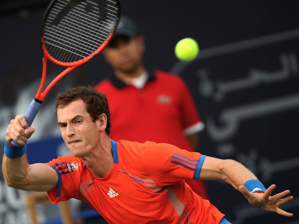 Andy Murray plays a forehand on his way to a semi-final victory over world No 1 Novak Djokovic in Dubai yesterday