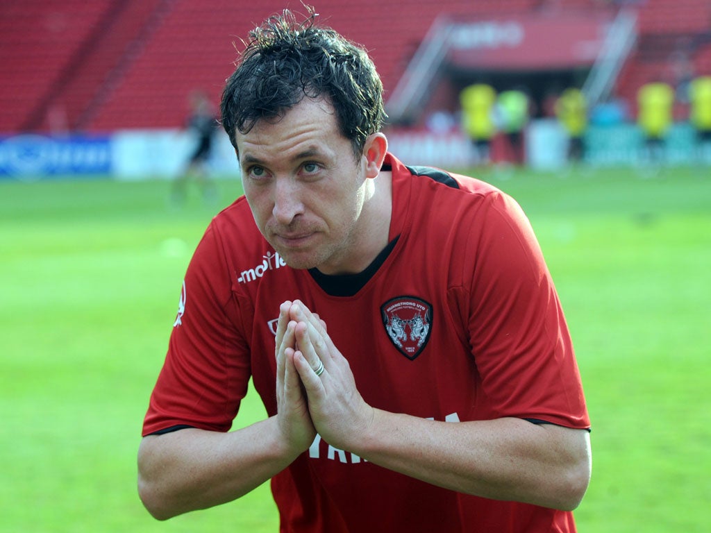 Robbie Fowler, now at Blackpool, gives a traditional Thai greeting during his spell at Muang thong United