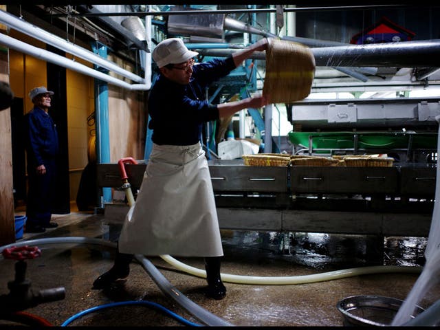 The rice being shaken after it has been washed ready for steaming at the Urakasumi Sake Brewery in Shiogama, Miyagi