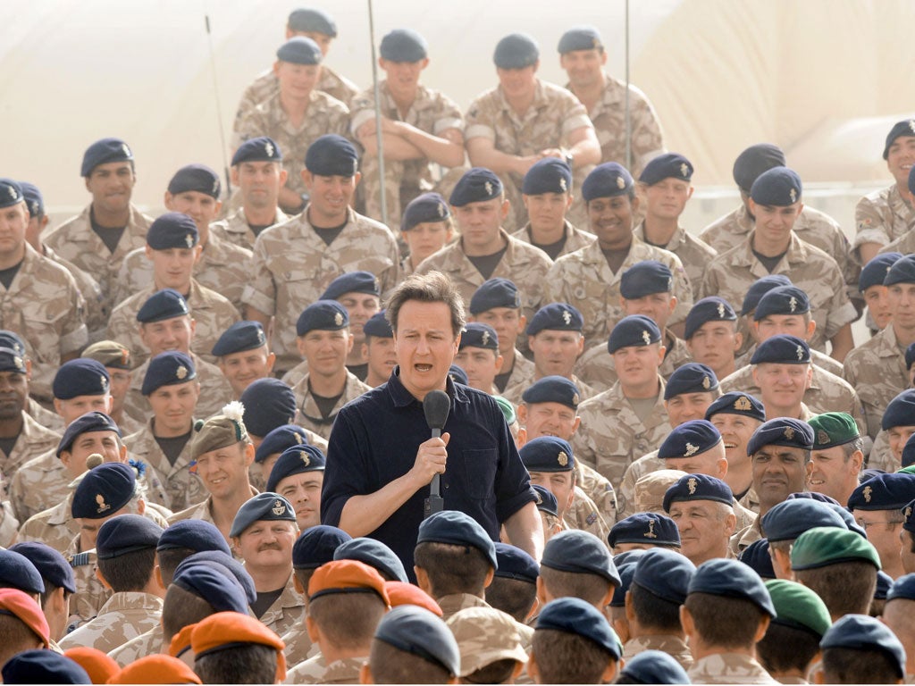David Cameron at Camp Bastion last year. But there is work to do now