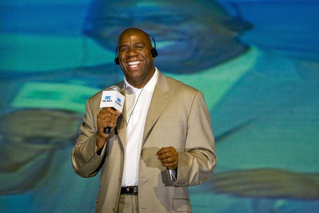 The former basketball star Earvin 'Magic' Johnson beams during a press conference at the first World Sports Congress in Mexico City in October 2008
