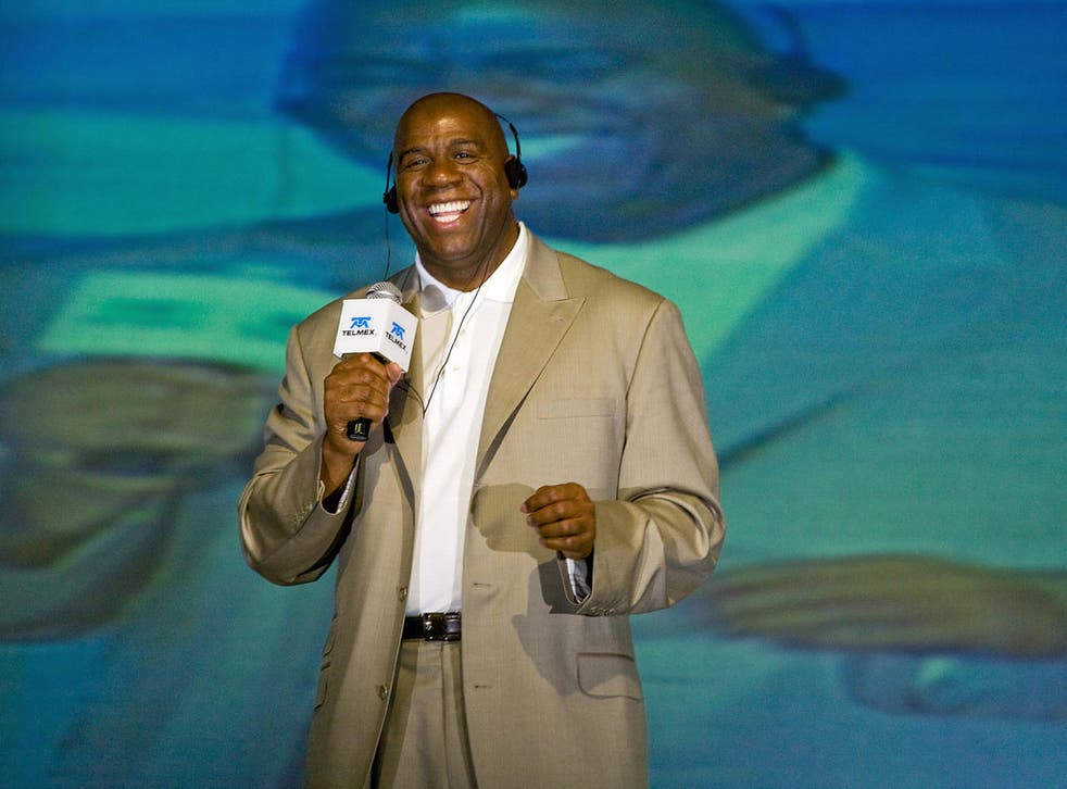 The former basketball star Earvin 'Magic' Johnson beams during a press conference at the first World Sports Congress in Mexico City in October 2008