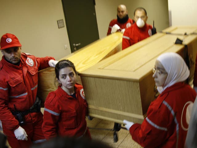 Coffins containing the bodies of Marie Colvin and photographer Remi Ochlik