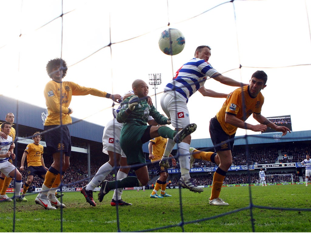 Bobby Zamora heads the ball on to Everton’s goalkeeper Tim Howard to score a deflected goal