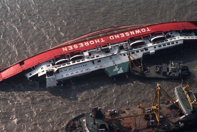 Boats attend the Herald of Free Enterprise the day after the disaster in March 1987. The bow doors had been left open as she left the Belgian port; she capsized so quickly there was no time to send an SOS