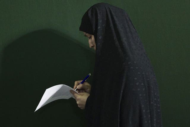 Iranians, living with the threat of war and crippling sanctions, voted in parliamentary elections on Friday