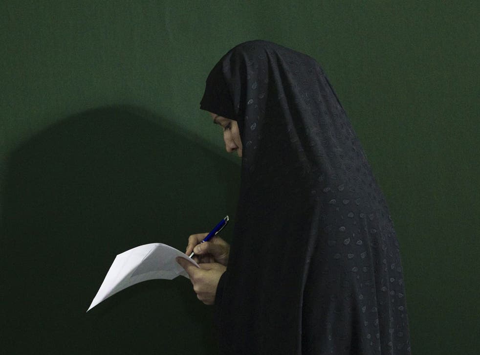 Iranians, living with the threat of war and crippling sanctions, voted in parliamentary elections on Friday
