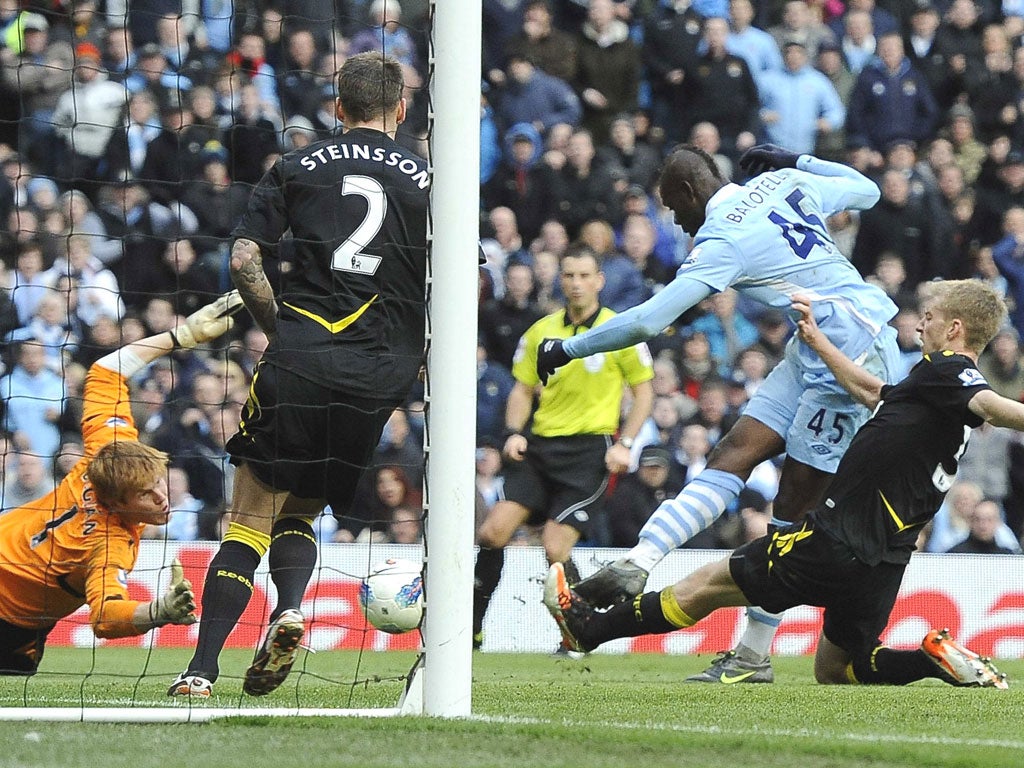 Mario Balotelli scores Manchester City’s second goal against
Bolton