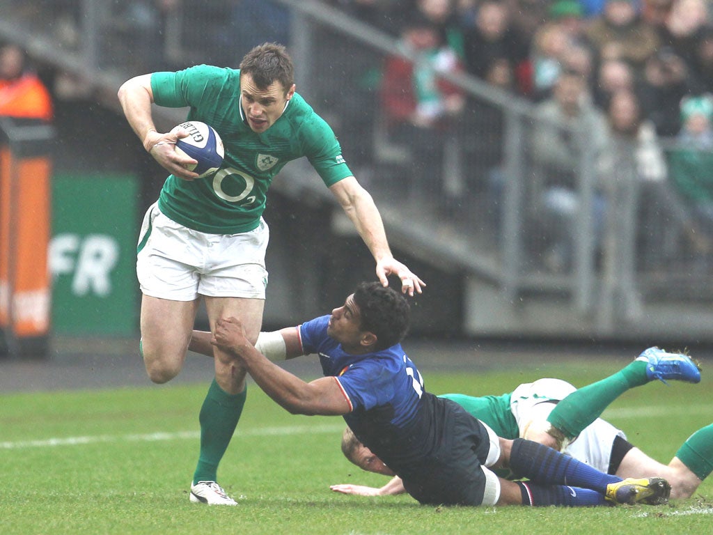 Wesley Fofana of France struggles to tackle Ireland’s Tommy Bowe, who scored two tries