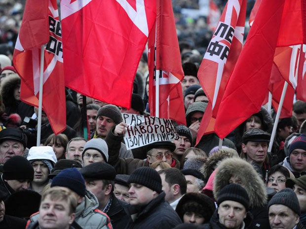 Opposition activists rally demanding fair elections at the Pushkinskaya Square in central Moscow