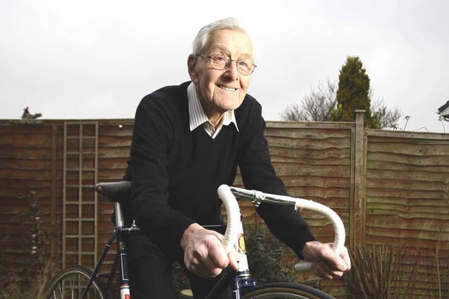 Tommy Godwin at home in Solihull with the bike on which he won the medals