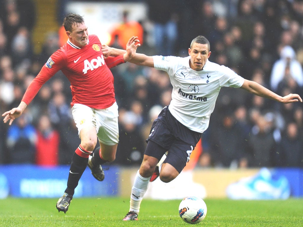Tottenham’s Jake Livermore battles with Manchester United’s Phil Joneson Sunday