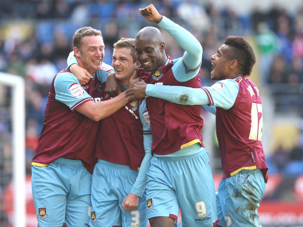 West Ham’s George Mc Cartney (second left) celebrates his goal
against Cardiff City in the 2-0 win at the weekend