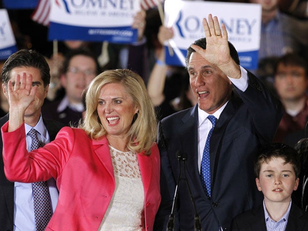Mitt Romney waves with his wife Ann at his primary election night rally in Boston
