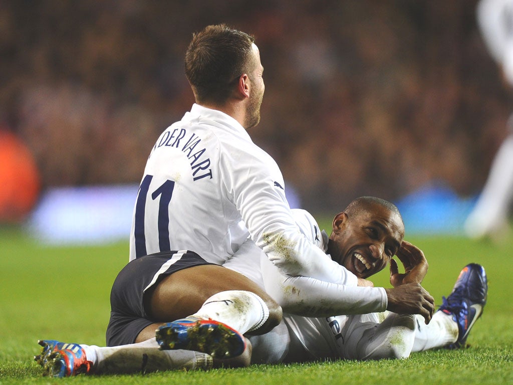 Jermain Defoe shows his delight at his second goal as
Rafael van der Vaart adds his congratulations