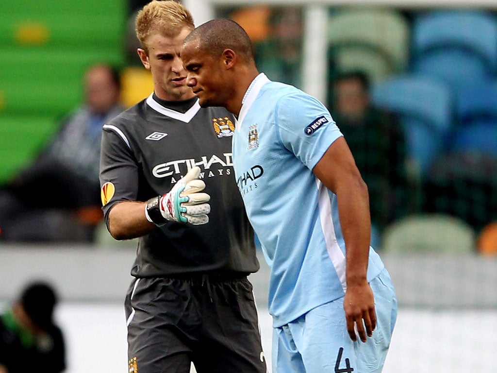 Vincent Kompany of Manchester City leaves the field injured during yesterday's match