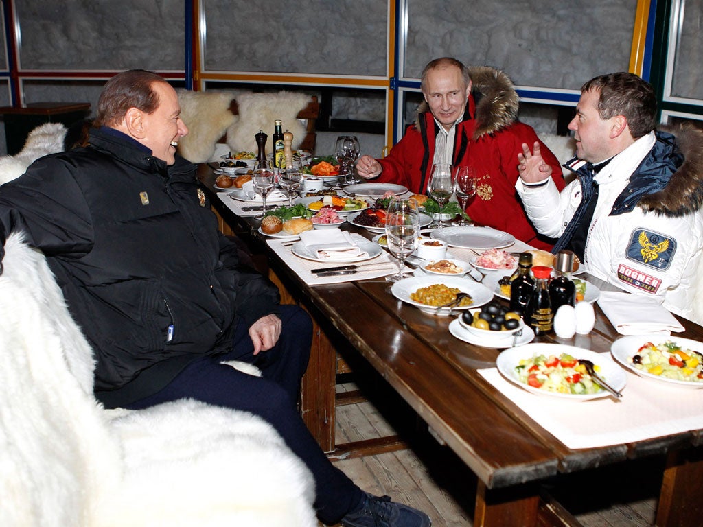 Italian Prime Minister Silvio Berlusconi (left) dropped in on Vladimir Putin for a spot of skiing and a banquet or two