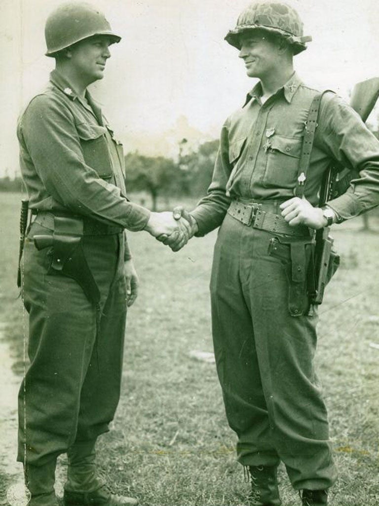 Kerchner, right receives his DSC from Lt-Col James Rudder in June 1944