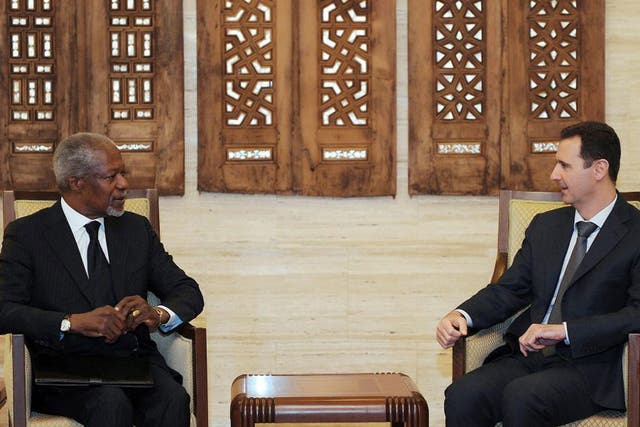 Syrian President Bashar Al-Assad (right) meeting with UN-Arab League envoy Kofi Annan (left) at the Syrian presidential palace in Damascus