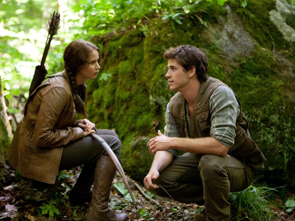 Katniss (Jennifer Lawrence) with Gale (Liam Hemsworth)