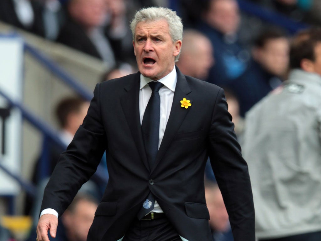 Mark Hughes reacts during the Barclays Premier League match between Bolton Wanderers and Queens Park Rangers