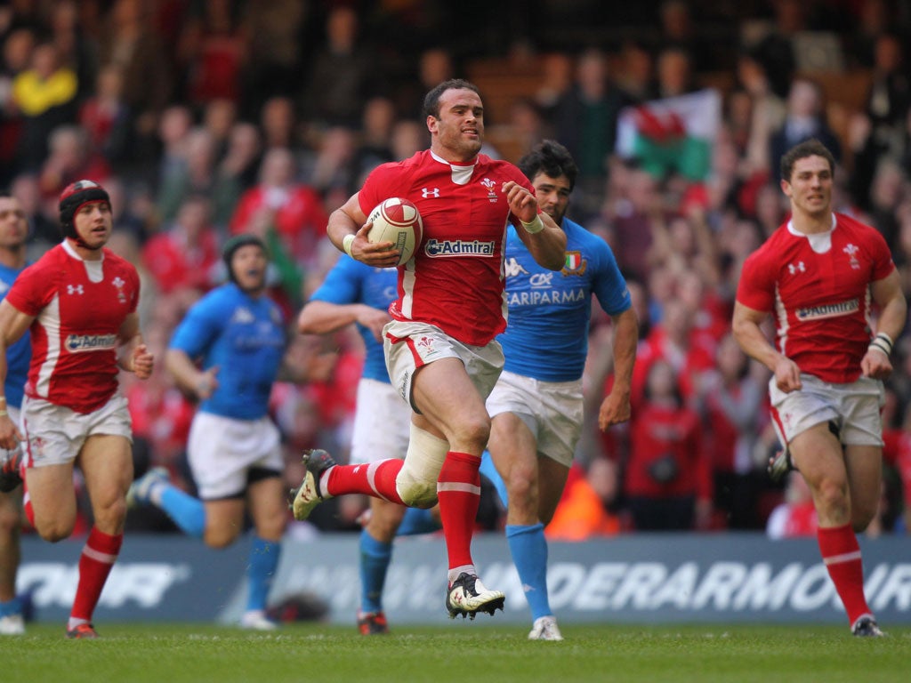 Wales centre Jamie Roberts breaks free before diving to score against Italy in Cardiff