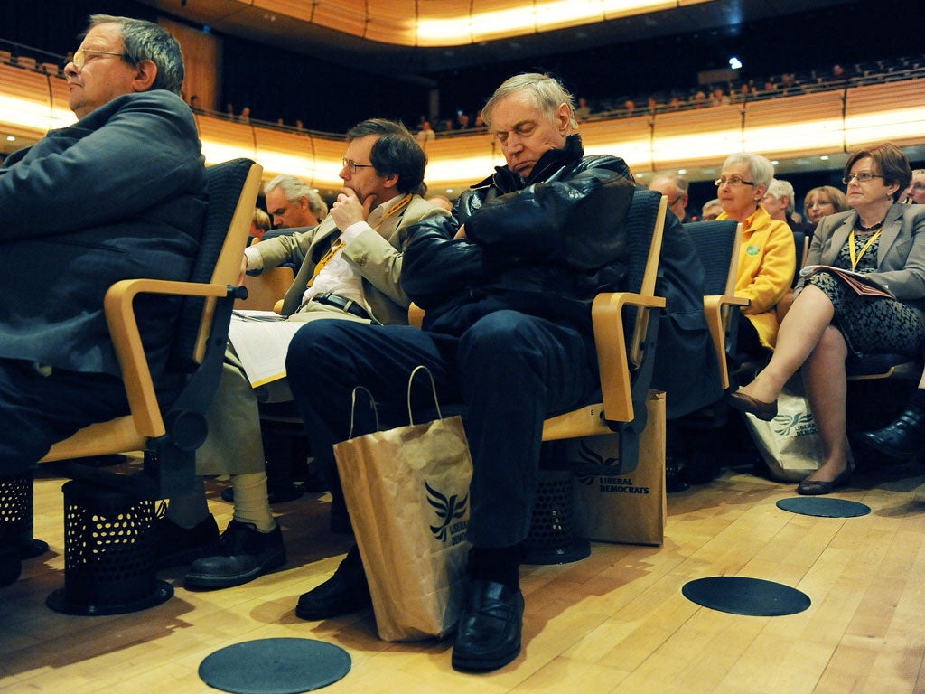 Uncon-Vince-d: Delegates listen to the Business Secretary's speech at the Lib Dem spring conference in Gateshead yesterday