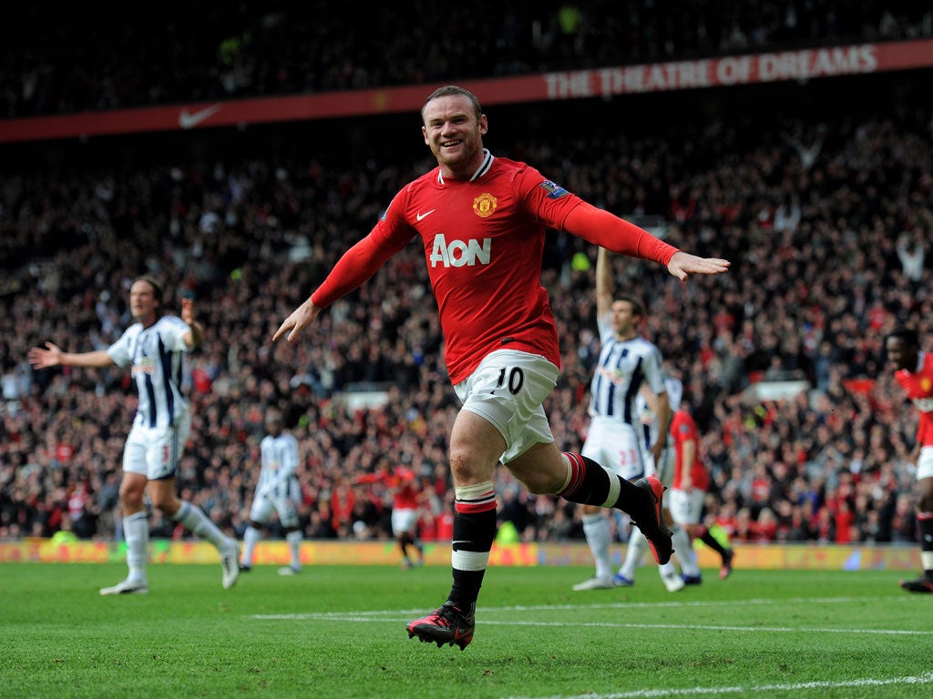 Rooney celebrates scoring the opening goal against West Bromwich Albion