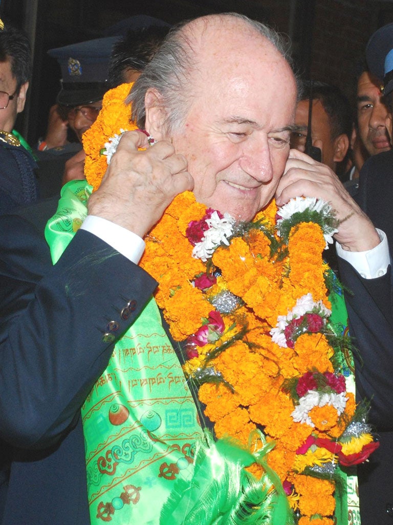 Fifa’s president, Sepp Blatter, is greeted upon arrival in Kathmandu