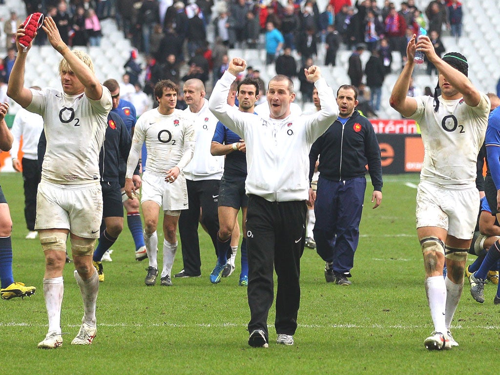 Stuart Lancaster enjoys the applause from England’s
supporters in Paris