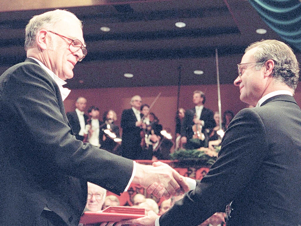 Sherwood, left, receives his Nobel Prize from King Carl XVI Gustaf of Sweden in Stockholm in 1995