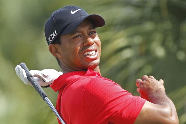 Tiger Woods feels the pain during the WGC Cadillac Championship