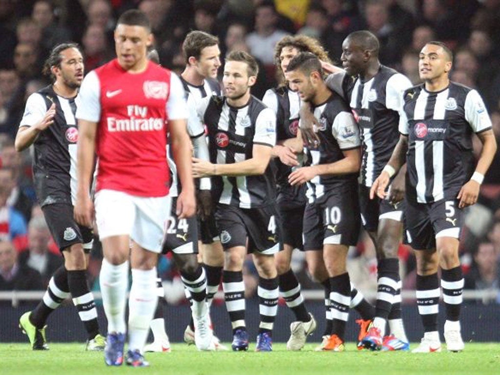 Hatem Ben Arfa celebrates with team-mates after scoring the opening goal during the Barclays Premier League match between Arsenal and Newcastle