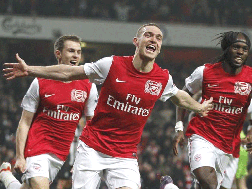 Thomas Vermaelen celebrates his dramatic late winner for Arsenal