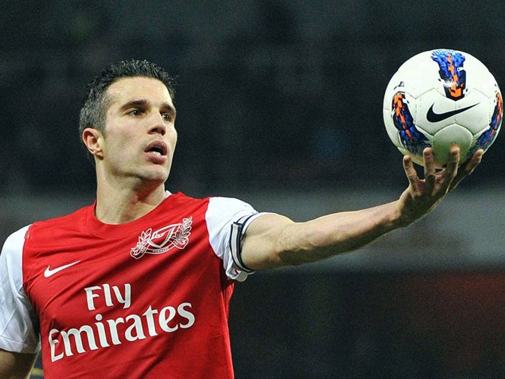 Robin van Persie, who scored Arsenal’s first goal, gets hold of the ball