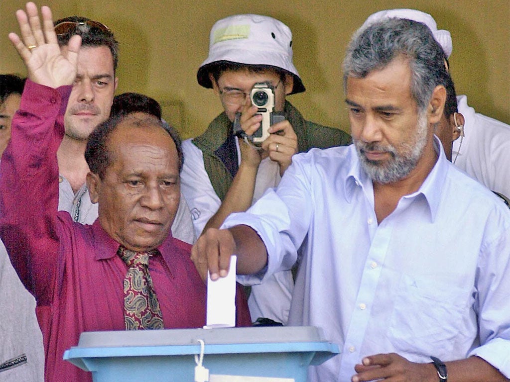 Amaral, left, votes in East Timor's 2002 presidential election, with the eventual victor, Xanana Gusmao