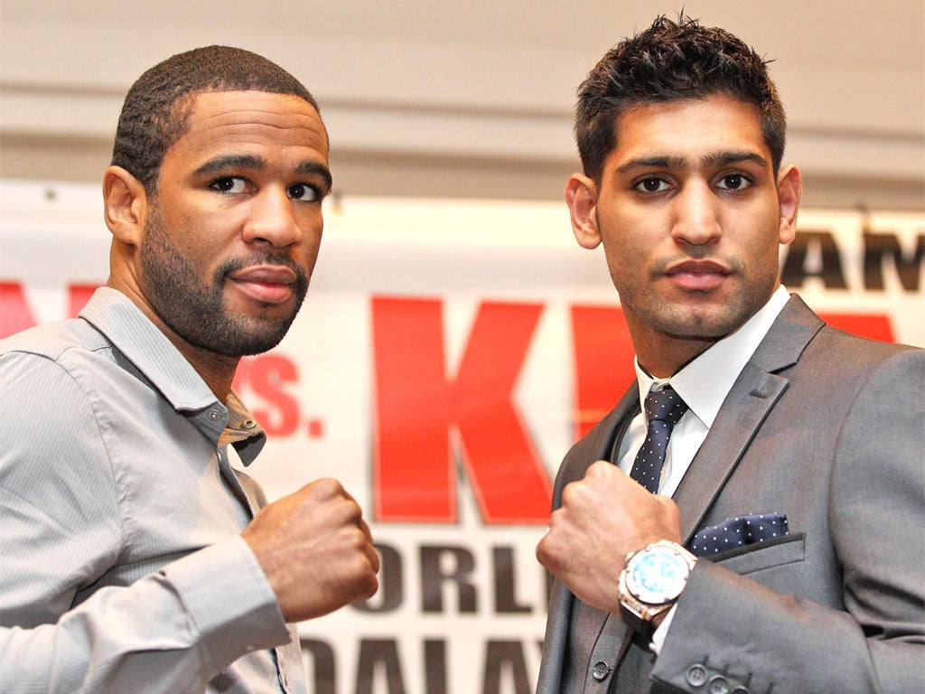 Amir Khan and Lamont Peterson (left) in London yesterday