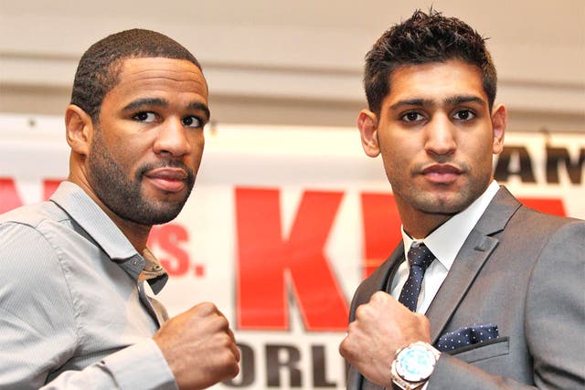 Amir Khan and Lamont Peterson (left) in London yesterday