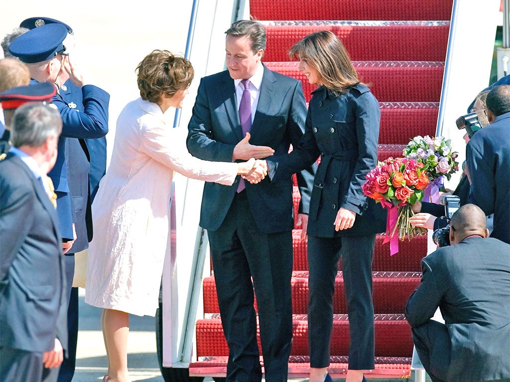 David and Samantha Cameron land in Maryland yesterday where they were greeted by the US Chief of Protocol Capricia Marshall