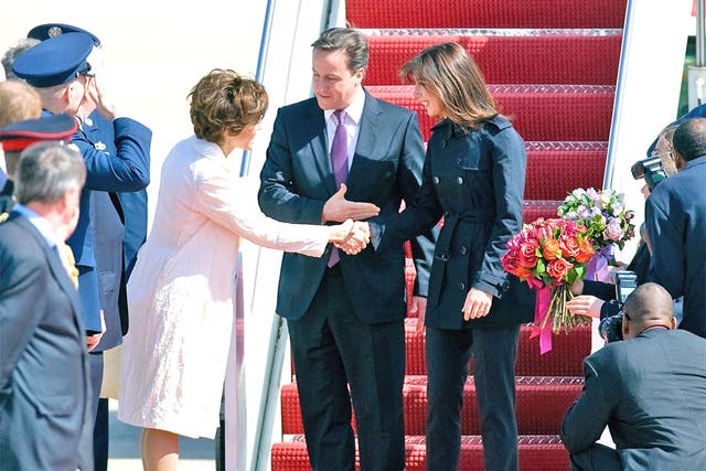 David and Samantha Cameron land in Maryland yesterday where they were greeted by the US Chief of Protocol Capricia Marshall