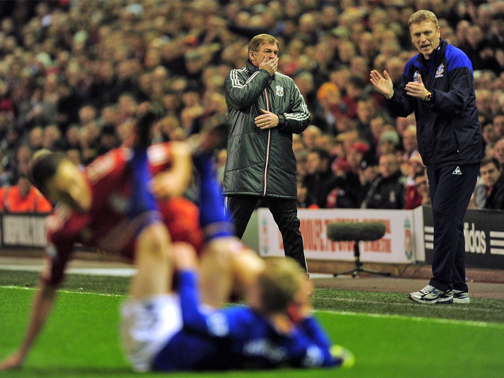 Kenny Dalglish (left) and David Moyes watch the action last night