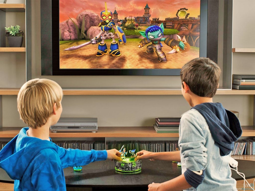 Touch screen: two children play with Skylanders' 'Portal of Power'