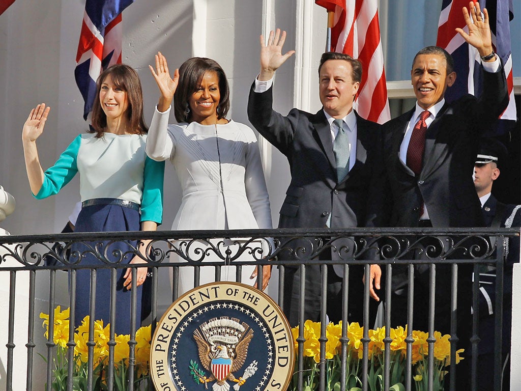 The Obamas and Camerons greet crowds gathered on the South Lawn of the White House