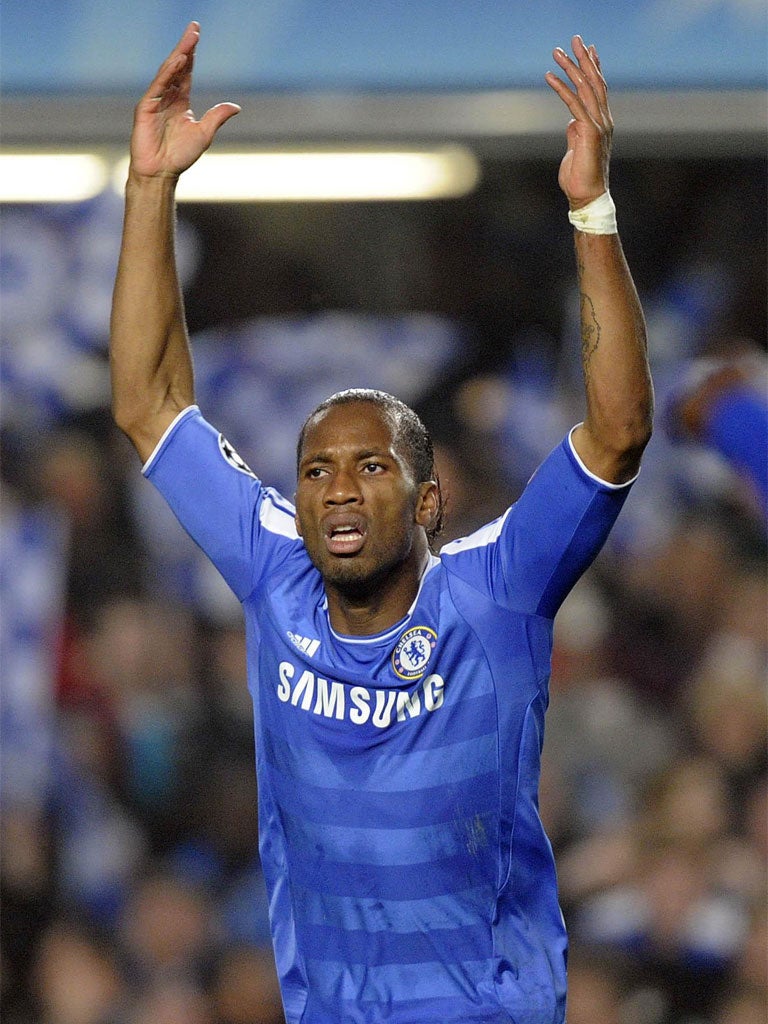 Didier Drogba tries to raise the fans after scoring the opener