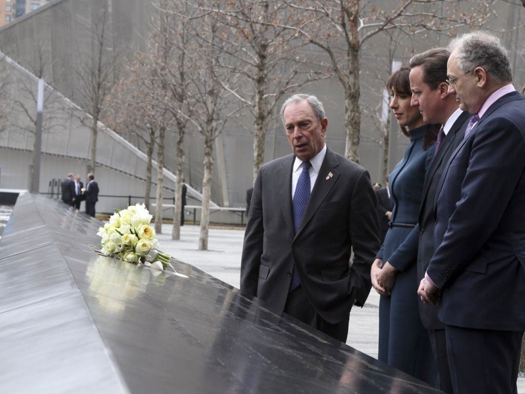 David Cameron stands with his wife Samantha Cameron and New York City Mayor Michael Bloomberg at the World Trade Center Memorial 