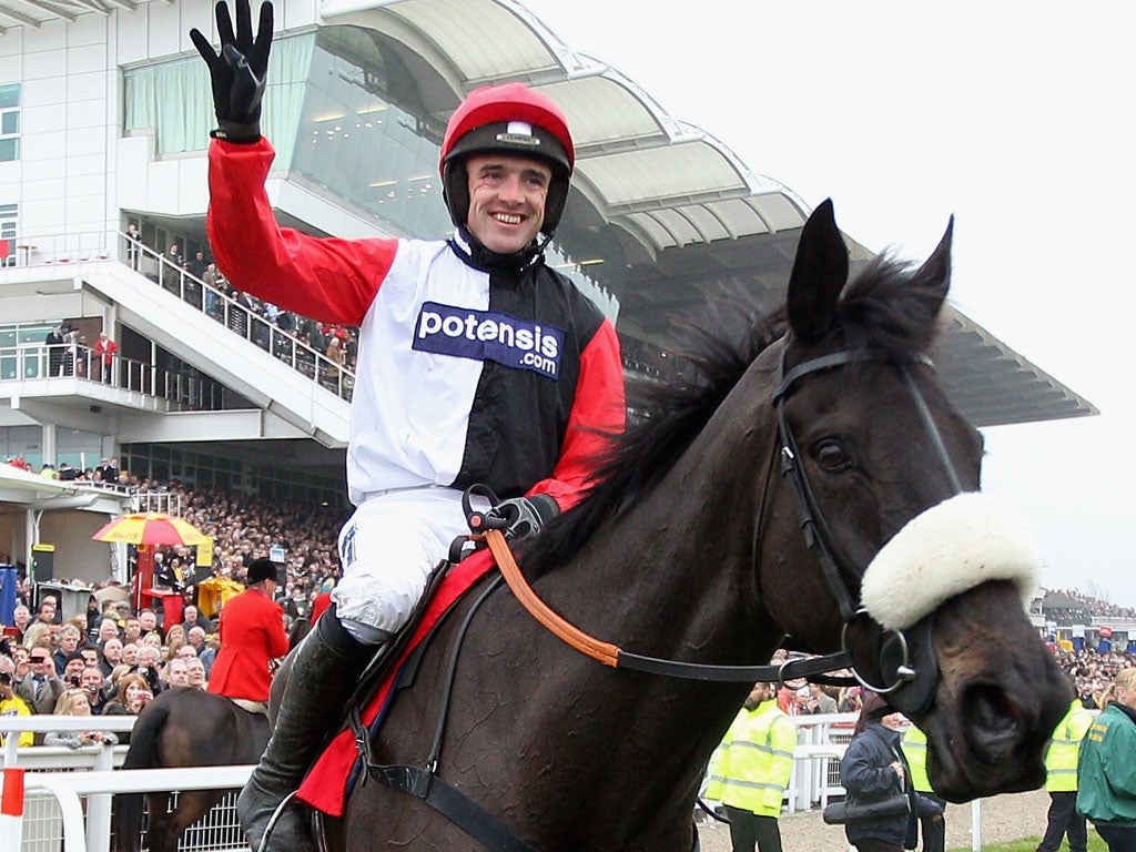 Ruby Walsh celebrates Big Buck's fourth victory in the World Hurdle at Cheltenham
