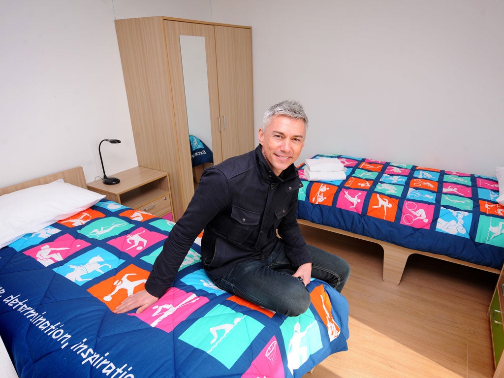 Jonathan Edwards, who is chair of the 2012 athletes' panel, in an apartment bedroom in the Olympic village