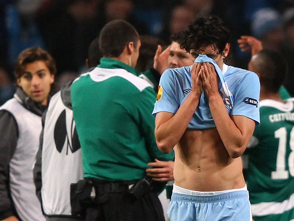 Stefan Savic walks dejected at the final whistle